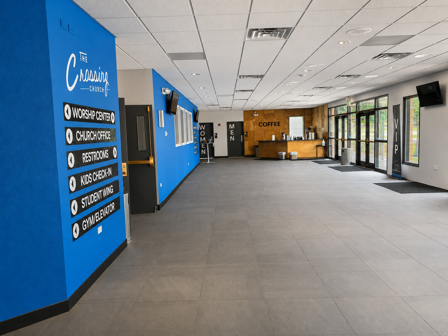 The Crossing lobby with blue wayfinding wall and directory